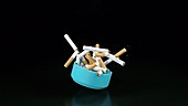 Ashtray with cigarettes, slow motion