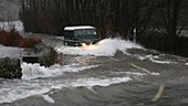 Vehicle driving through floodwater
