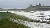 Woman in a storm on the coast