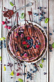 A wreath cake with berries and spices