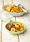 Seafood goulash with vegetables and colourful rice