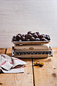 Damsons on an old pair of kitchen scales