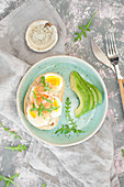 Healthy breakfast. Toast with egg, smoked salmon and arugula