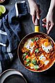 Shakshuka (baked eggs, North Africa) with coconut and curry
