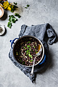 Cooked pinto beans, heirloom beans on a marble surface