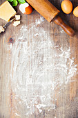 Fresh ingredients for baking on rustic background