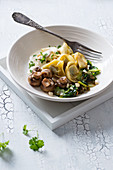 Tortellini with bok choy, mushrooms and cashew cream (vegan)