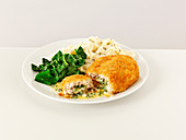 Chicken kiev with mashed potatoes and spinach