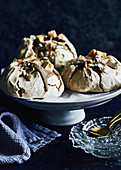 Caramel and toasted coconut meringues with dehydrated pinapple on top
