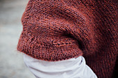 A hand-knitted, short-sleeved jumper (detail)