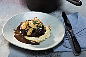 Sous vide ox cheeks with mushrooms on a creamy sage polenta