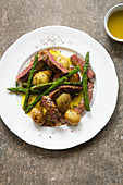 Roast new potatoes and asparagus with seared steak and mustard dressing