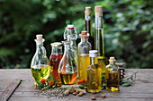 Various oils and oil extracts in bottles and carafes