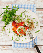 Yeast dumplings with tomato sacue with herbs