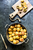 Apricots in a colander and on a chopping board