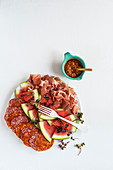 Salami cold cuts with watermelon and harissa