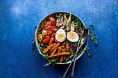 Lentil salad with carrots, fennel, tomatoes and egg