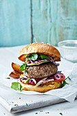 Lamb and mint burger with apple slaw in a brioche bun