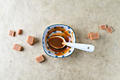 Toffees and caramel sauce in small dish