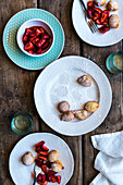 Lemon and ricotta fritters with strawberries in gin