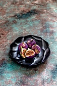 Figs on a black plate