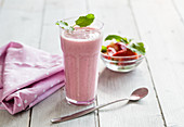 Strawberry smoothie with mint in a glass