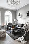 Elegant living room in shades of grey with arched windows