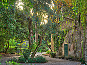 An old, ivy-covered boathouse, Isola del Garda, Lake Garda, Italy