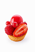 Tartlets with red fruits on a white background