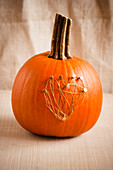 Pumpkin decorated with wire heart