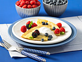 Dutch baby with orange flavouring and berries