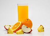 Pineapple, orange and apple juice in a glass