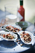 Oysters with pancetta and pine nuts