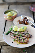 Fried venison steaks with buttered potatoes