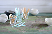 Kitchen utensils for finger food: bowls, toothpicks, and a glass of feathers