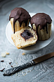 Vegan muffins with a nougat cream core and chocolate glaze