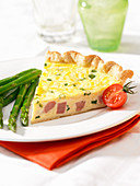 Slice of ham quiche with chive