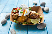 Fried potatoes with a poached egg and spring onions (Korea)