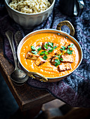 Helathy vegan version of paneer tikka masala with grilled tofu cubes and cashew cream, served with quinoa