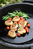 Grilled puff pastries with sausage meat and leek
