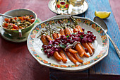 Roasted carrots with a beetroot and pomegranate sauce and peppermint