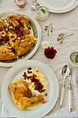 Zereshk Polo ba Morgh (saffron-braised chicken legs on barberry rice, Persia)