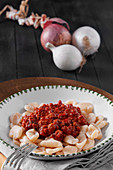 Plate of orecchiette pasta with Bolognese sauce