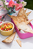 Baked tortilla chips with sweetcorn salad for a school lunch