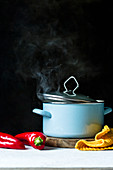 A steaming enamel pot
