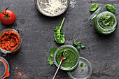Red and green pesto with tomatoes and herbs