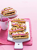 Strawberry and pistachio eclairs