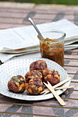 Grilled minced meat and shrimp balls with a tomato dip