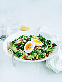 Kale and quinoa salad with avocado and egg