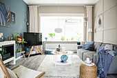 Scandinavian-style living room with blue and beige walls